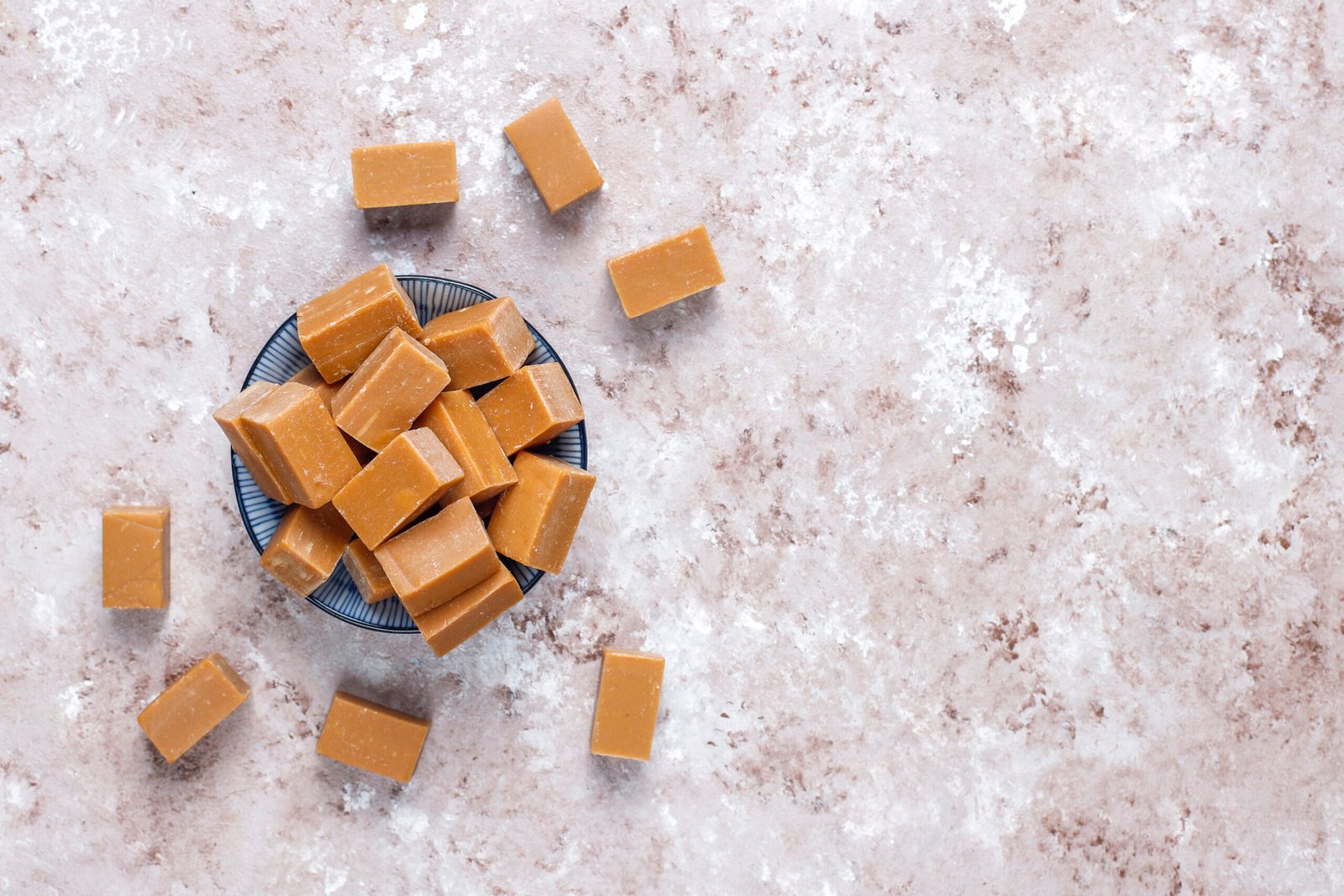 Tasty salty caramel fudge candies with sea salt,top view